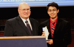 USCHS Vice President presents Omar Qureshi with his award. (USCHS)